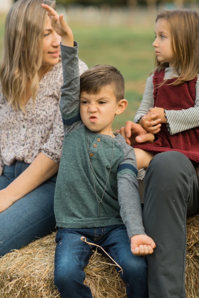 Fall is in full swing here in NJ, my first Fall Family session with Anna and Adam at their Farm House in Hackettstown NJ. Anna and Adam recently purchased their dream farm house on a 4 acres of land. This family of four now has chickens, ducks, birds, cats, a dog, sheep and plans to add many more to the list in the future. I had the honor of visiting Anna and Adam and their two beautiful children at their Farm the other day. I got much need vitamin D walking around the property, enjoying the foliage, running around with their kids and meeting all the farm animals. I sincerely enjoy photographing families now because there are no dull moments with kids, every moment is perfect! Fall family session at Anna and Adam’s Farm at Hackettstown NJ photographed by Karis from HeyKaris.